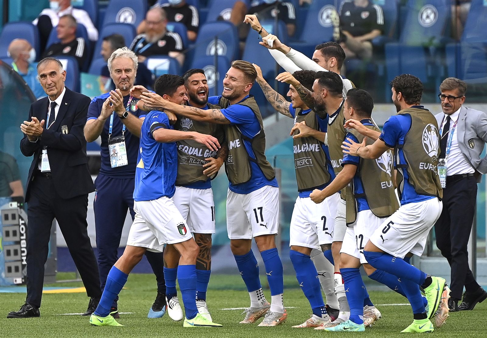 epa09288892 Matteo Pessina (3-L) of Italy celebrates with teammates after scoring the 1-0 lead during the UEFA EURO 2020 group A preliminary round soccer match between Italy and Wales in Rome, Italy, 20 June 2021.  EPA/Riccardo Antimiani / POOL (RESTRICTIONS: For editorial news reporting purposes only. Images must appear as still images and must not emulate match action video footage. Photographs published in online publications shall have an interval of at least 20 seconds between the posting.)