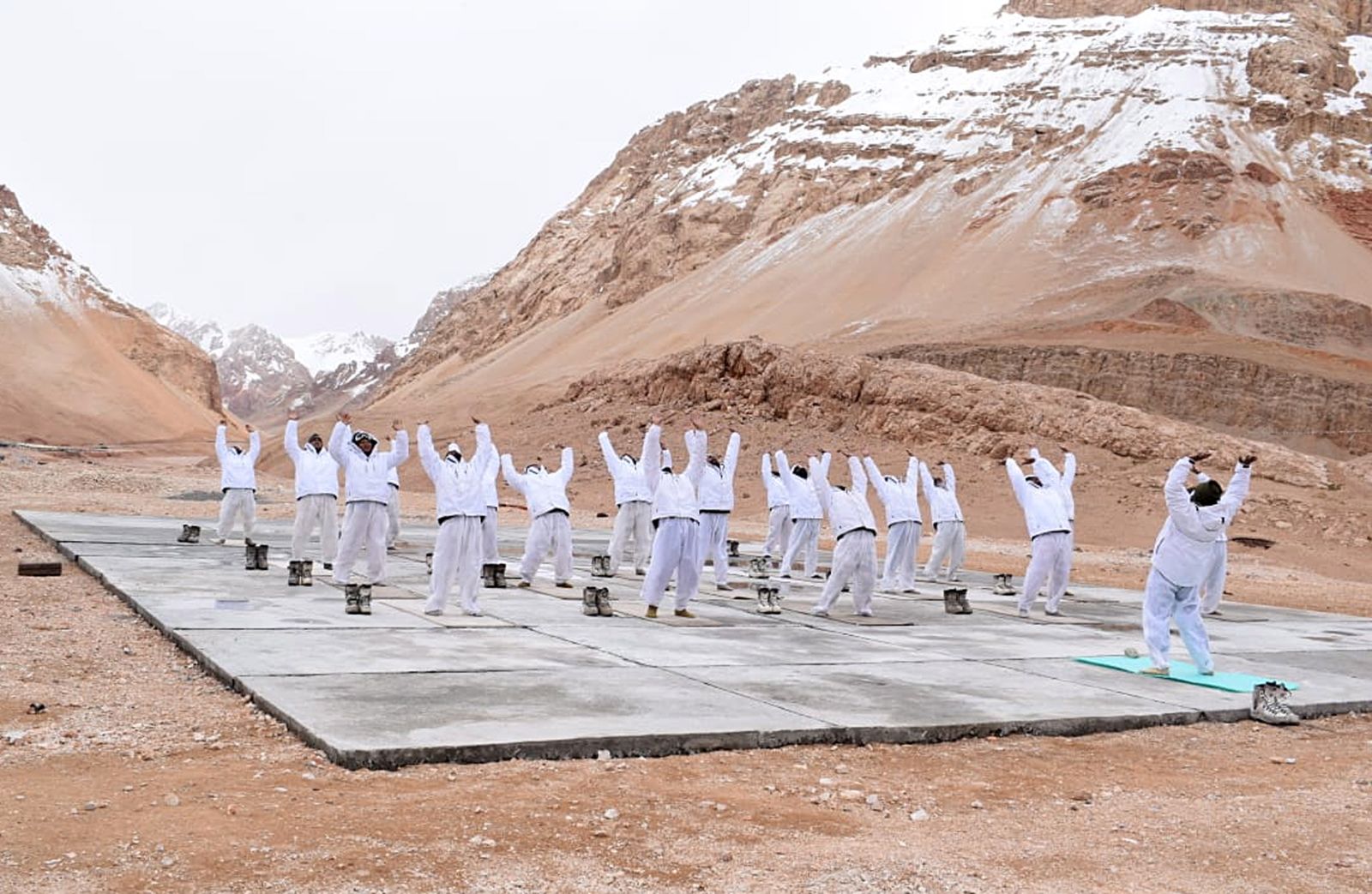 epa09289868 A handout photo made available by the Indo-Tibetan Border Police (ITBP) shows Indo-Tibetan Border Police officers performing yoga during the International Day of Yoga at a height of about 15,000 feet in Ladakh, India, 21 June 2021. In December 2014, the United Nations (UN) declared 21 June as the International Day of Yoga after adopting a resolution proposed by Indian Prime Minister Narendra Modi.  EPA/INDO-TIBETAN BORDER POLICE HANDOUT  HANDOUT EDITORIAL USE ONLY/NO SALES