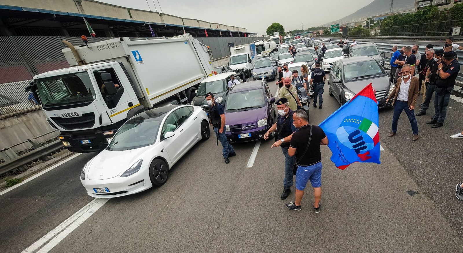epa09298844 Whirlpool workers block the motorway as they protest against the closure of the Naples plant, in Naples, Italy, 24 June 2021. Whirlpool on 23 June said it will start the procedure of collective dismissal for the workers of the Naples plant from 01 July on. The start of the procedure gives 75 days of time to find an agreement between the parties.  EPA/CESARE ABBATE