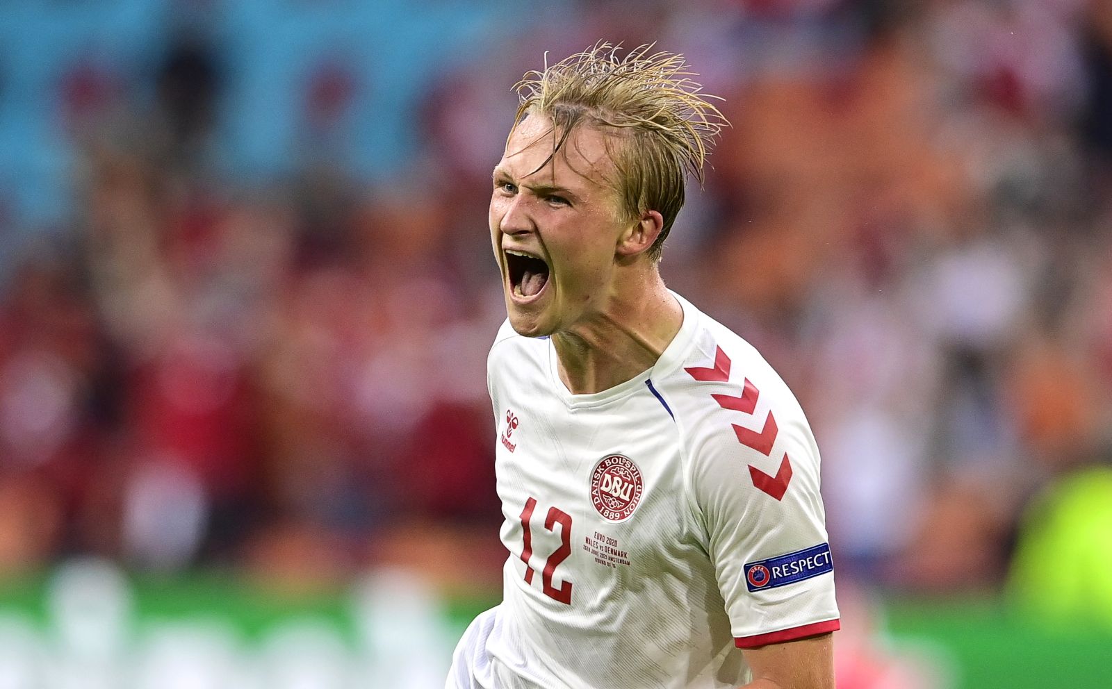 epa09303617 Kasper Dolberg of Denmark celebrates after scoring the 2-0 lead during the UEFA EURO 2020 round of 16 soccer match between Wales and Denmark in Amsterdam, Netherlands, 26 June 2021.  EPA/Olaf Kraak / POOL (RESTRICTIONS: For editorial news reporting purposes only. Images must appear as still images and must not emulate match action video footage. Photographs published in online publications shall have an interval of at least 20 seconds between the posting.)