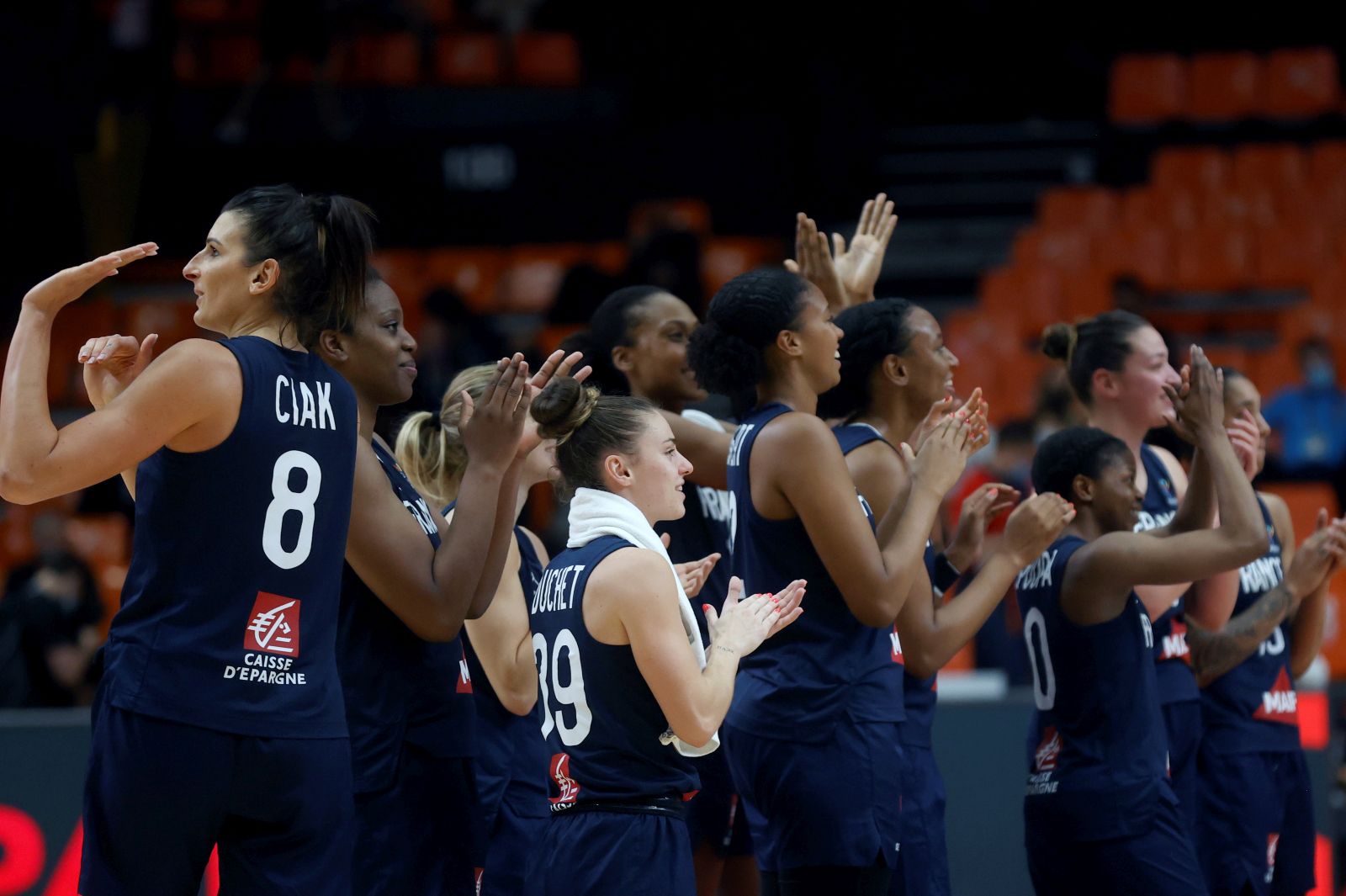 epa09303729 France's players celebrate their victory against France during the Eurobasket 2021 women's semifinal basketball match between Belarus and France held at Fuente San Luis arena in Valencia, Spain, 26 June 2021.  EPA/Kai Forsterling