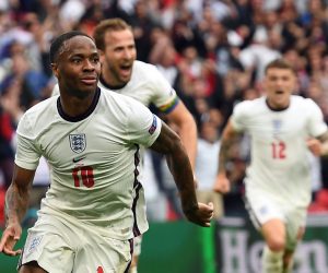 epa09311537 Raheem Sterling of England celebrates scoring  the 1-0 during the UEFA EURO 2020 round of 16 soccer match between England and Germany in London, Britain, 29 June 2021.  EPA/Andy Rain / POOL (RESTRICTIONS: For editorial news reporting purposes only. Images must appear as still images and must not emulate match action video footage. Photographs published in online publications shall have an interval of at least 20 seconds between the posting.)