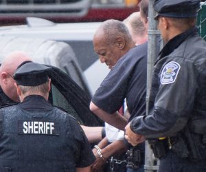 epa09313986 (FILE) - US entertainer Bill Cosby (C, white shirt) is escorted from the Montgomery County Courthouse in Norristown, Pennsylvania, USA, 25 September 2018 (reissued 30 June 2021). The Pennsylvania Supreme Court on 30 June 2021 overturned the conviction of Bill Cosby on sex assault charges.  EPA/TRACIE VAN AUKEN *** Local Caption *** 54653434