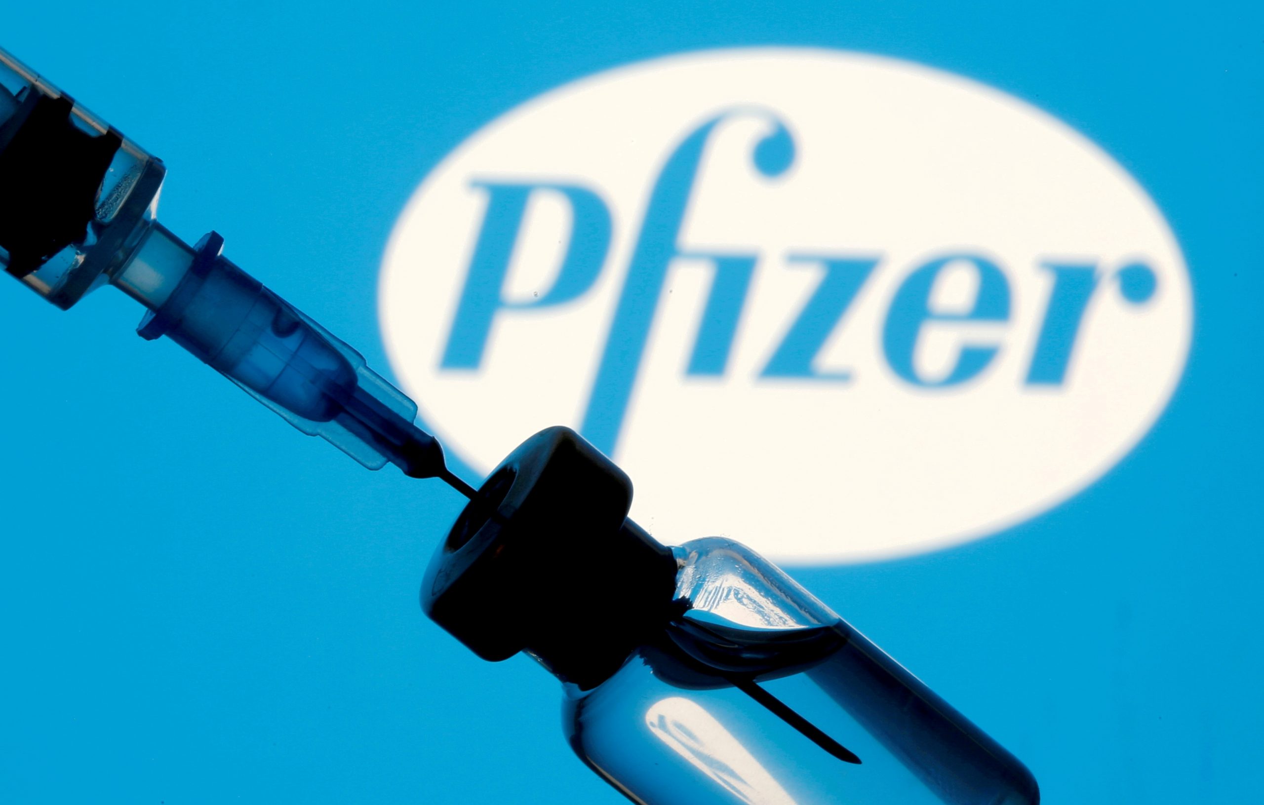 FILE PHOTO: Vial and syringe are seen in front of displayed Pfizer logo FILE PHOTO: A vial and syringe are seen in front of a displayed Pfizer logo in this illustration taken January 11, 2021. REUTERS/Dado Ruvic/Illustration/File Photo Dado Ruvic