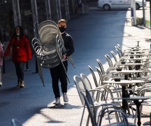 FILE PHOTO: A worker carries chairs at Les Arches bar in the city centre, as coronavirus disease (COVID-19) lockdown restrictions ease, in Lausanne, Switzerland April 19, 2021 FILE PHOTO: A worker carries chairs at Les Arches bar in the city centre, as coronavirus disease (COVID-19) lockdown restrictions ease, in Lausanne, Switzerland April 19, 2021. REUTERS/Denis Balibouse/File Photo DENIS BALIBOUSE