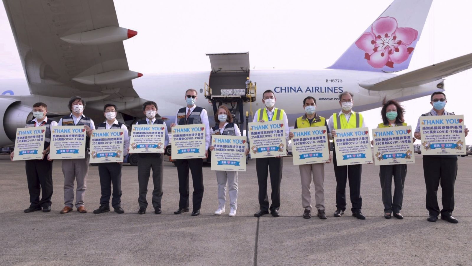 epa09287832 A handout photo made available by Taiwan Centers for Disease Control shows Taiwan Health Minister Chen Shih-chung(4R),  American Institute in Taiwan (AIT) Director Brent Christensen(5R) and Taiwanese officials posing for photograph next to airport workers unloading from a cargo plane boxes of Moderna Covid-19 vaccine from the US, in Taoyuan International airport, Taiwan, 20 June 2021. Taiwan received 2.5 million doses of Moderna Covid-19 vaccine donated by the United States government. Taiwan President Tsai Ing-wen thanked the US Government for the donation.  EPA/TAIWAN CDC HANDOUT  HANDOUT EDITORIAL USE ONLY/NO SALES HANDOUT EDITORIAL USE ONLY/NO SALES