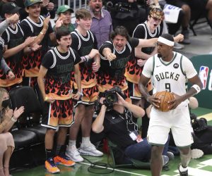 Milwaukee Bucks fans cheer for forward Bobby Portis after he scored against the Atlanta Hawks during the third quarter in Game 5 of the Eastern Conference finals in the NBA basketball playoffs Thursday, July 1, 2021, in Milwaukee. (Curtis Compton/Atlanta Journal-Constitution via AP)