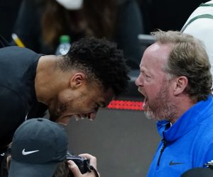 Milwaukee Bucks coach Mike Budenholzer and inured forward Giannis Antetokounmpo celebrate after the Bucks defeated the Atlanta Hawks in Game 6 of the Eastern Conference finals in the NBA basketball playoffs, advancing to the NBA Finals, Saturday, July 3, 2021, in Atlanta. (AP Photo/John Bazemore)