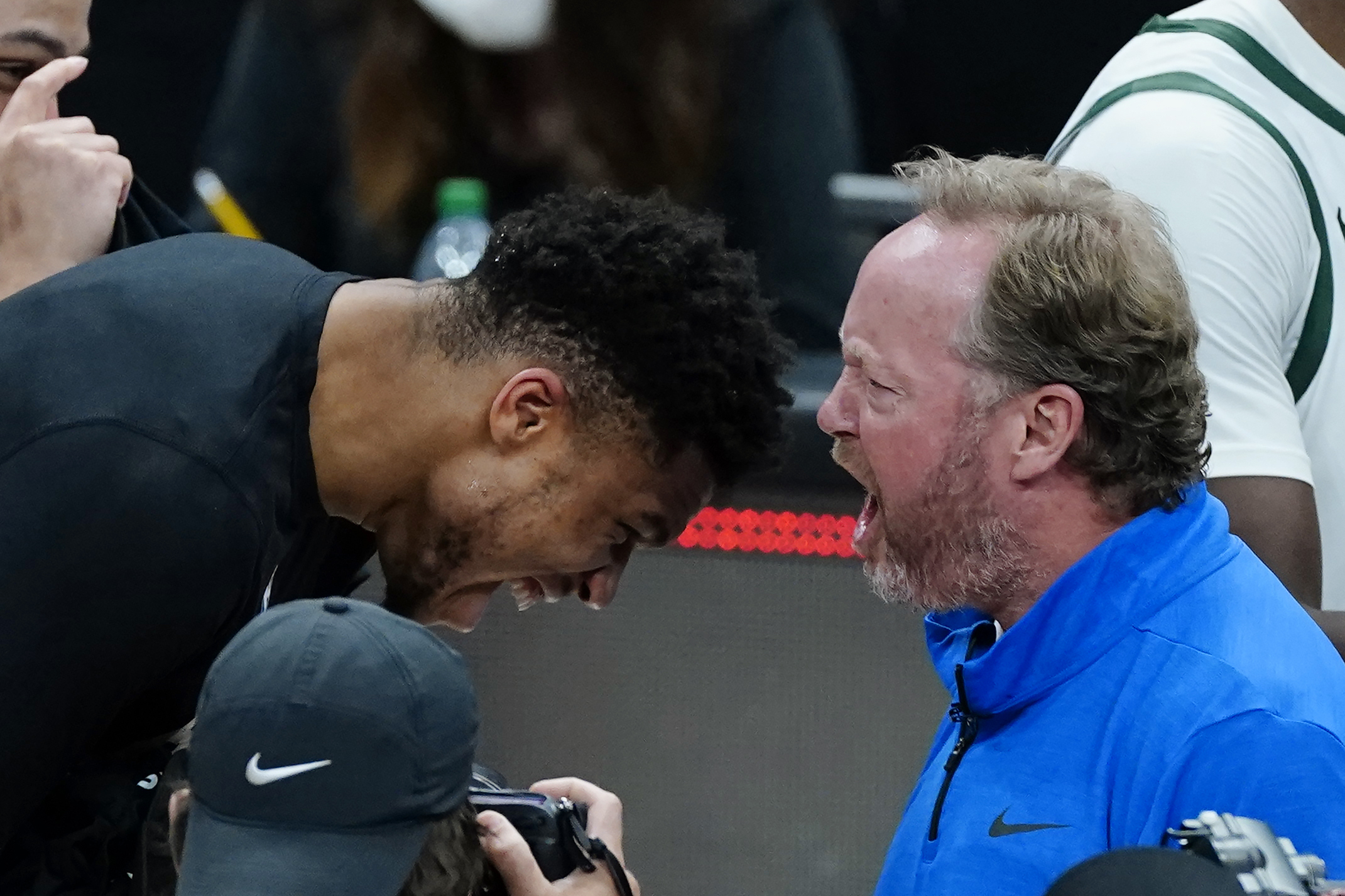 Milwaukee Bucks coach Mike Budenholzer and inured forward Giannis Antetokounmpo celebrate after the Bucks defeated the Atlanta Hawks in Game 6 of the Eastern Conference finals in the NBA basketball playoffs, advancing to the NBA Finals, Saturday, July 3, 2021, in Atlanta. (AP Photo/John Bazemore)