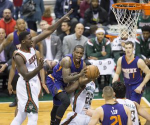January 6, 2015: Milwaukee Bucks forward Khris Middleton (22) takes a charge during the NBA game between the Phoenix Suns and the Milwaukee Bucks at the BMO Harris Bradley Center in Milwaukee, WI. Suns defeated the Bucks 102-96. John Fisher/CSM (Cal Sport Media via AP Images)