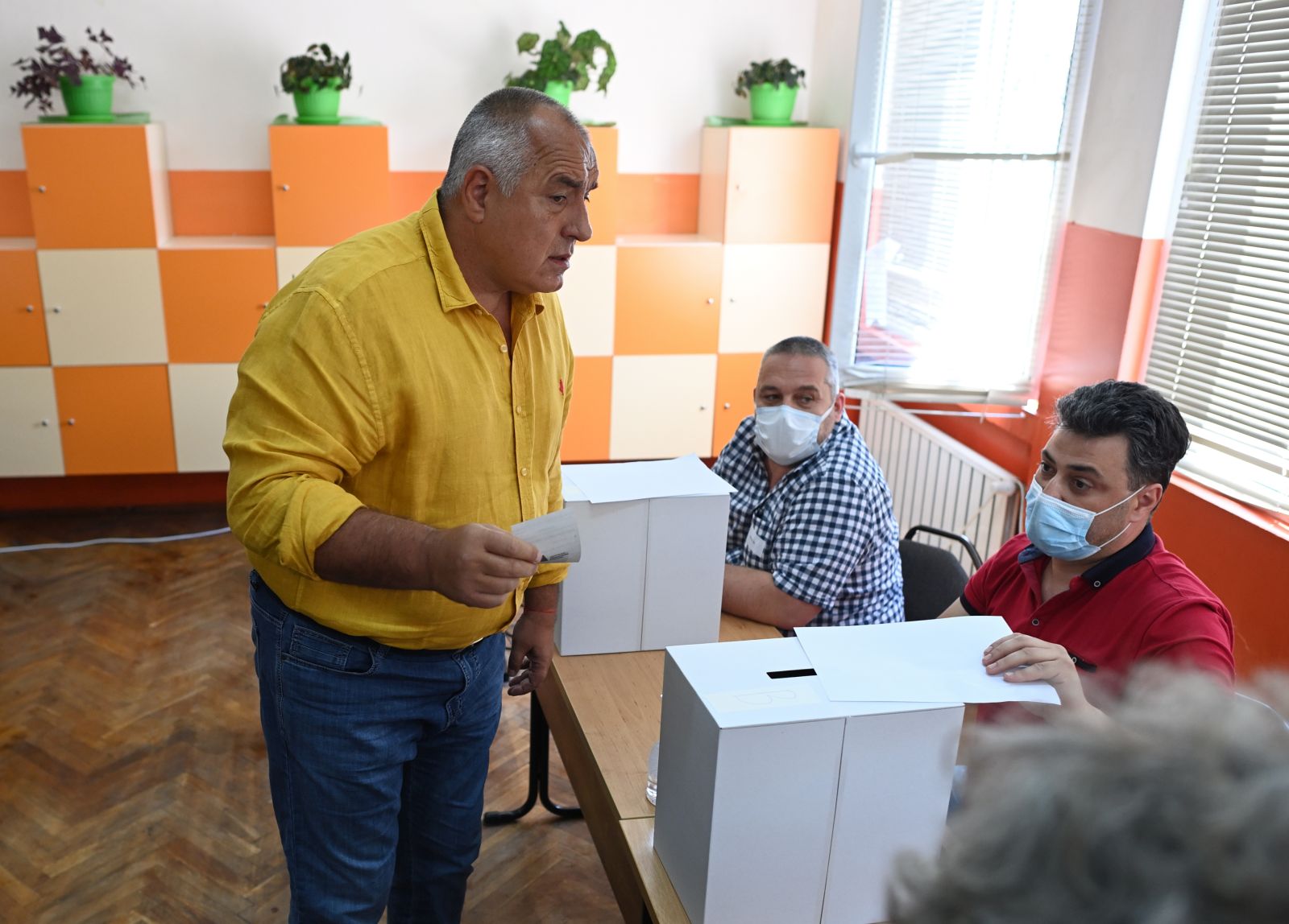epa09336584 Bulgarian former prime minister Boyko Borissov, the leader of the GERB party, casts his vote at a polling station during the country's parliamentary elections in Sofia, Bulgaria, 11 July 2021. Until the polls close at 8:00 p.m. (5:00 p.m. GMT), voters will be able to choose between 23 parties and alliances, seven fewer than the previous 04 April legislatures, to form the new 240-seat Parliament. Victory will be contested by the conservatives of the Bulgarian Citizens for European Development (GERB), led by former Prime Minister Boyko Borissov, and by There Is Such a People, a political party recently founded by singer and television host Slavi Trifonov.  EPA/VASSIL DONEV