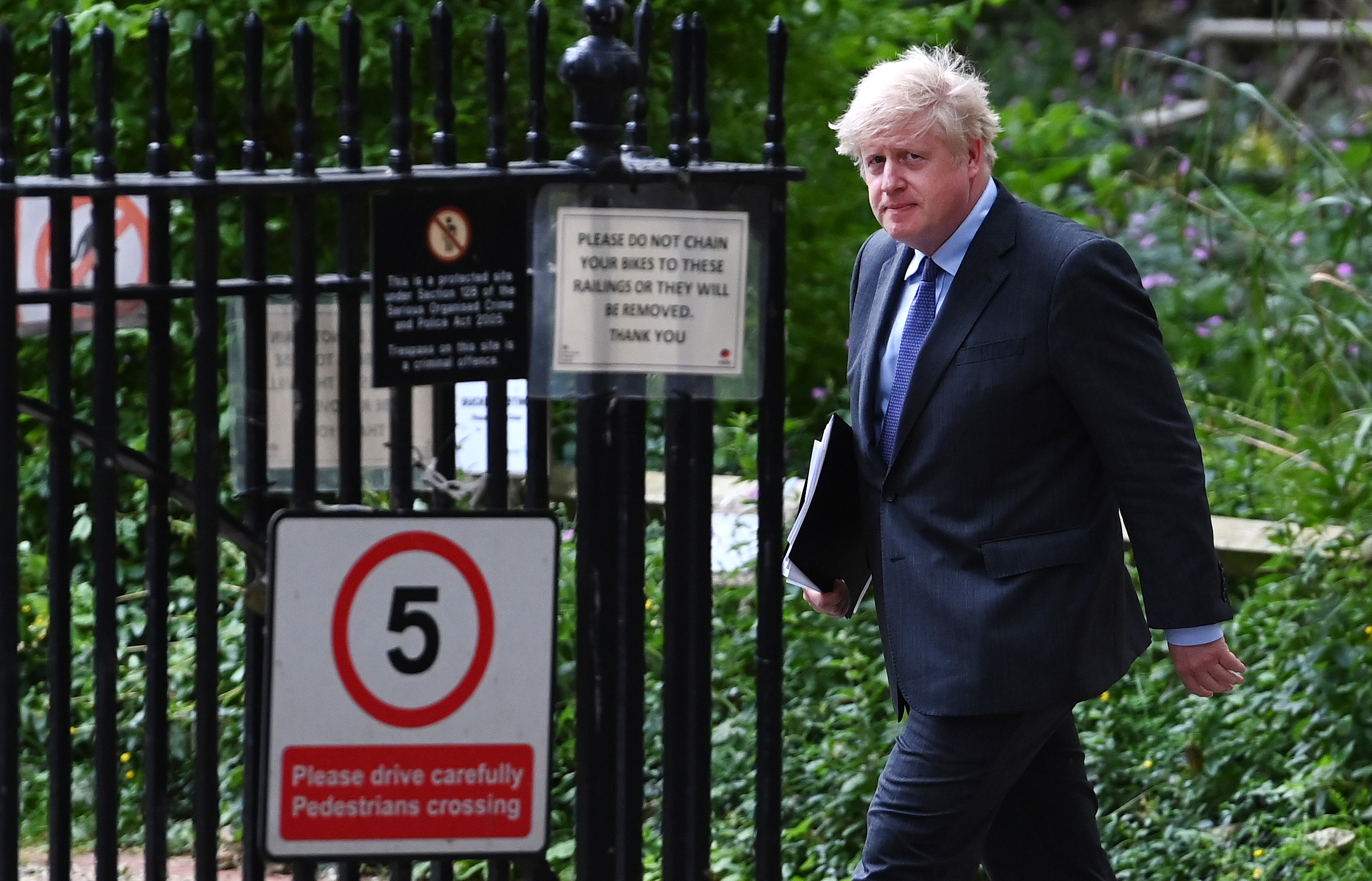 epa09271590 British Prime Minister Boris Johnson at 10 Downing Street following his press conference in London, Britain, 14 June 2021. British Prime Minister Johnson announced a month delay to lockdown easing regulations. The UK government is to delay for a further four weeks to full reopening due to a significant rise in Delta variant Covid-19 cases across England.  EPA/ANDY RAIN