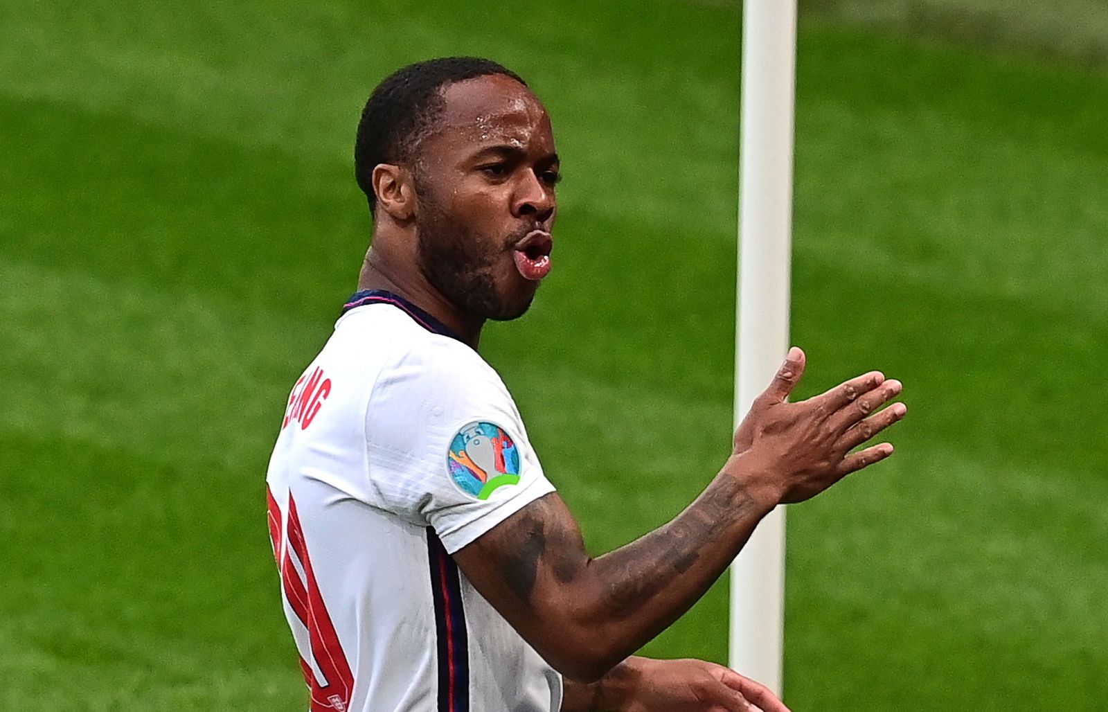 epa09294081 Raheem Sterling of England celebrates after scoring the 1-0 lead during the UEFA EURO 2020 group D preliminary round soccer match between the Czech Republic and England in London, Britain, 22 June 2021.  EPA/Neil Hall / POOL (RESTRICTIONS: For editorial news reporting purposes only. Images must appear as still images and must not emulate match action video footage. Photographs published in online publications shall have an interval of at least 20 seconds between the posting.)