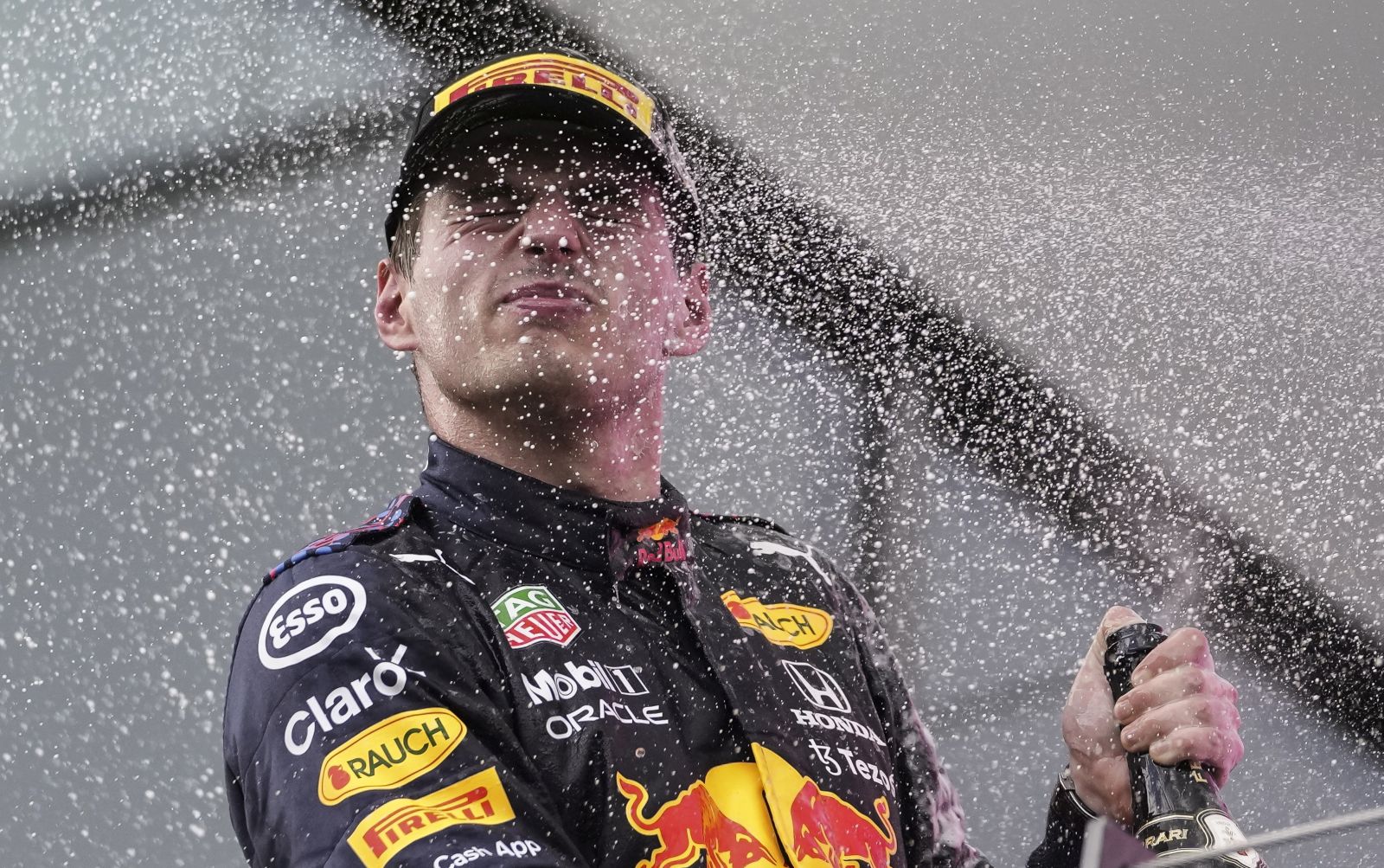 epa09305508 Dutch Formula One driver Max Verstappen of Red Bull Racing celebrates on the podium after winning the Formula One Grand Prix of Styria at the Red Bull Ring in Spielberg, Austria, 27 June 2021.  EPA/Darko Vojinovic / POOL