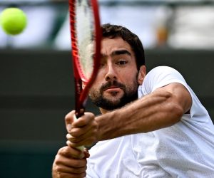 epa09320553 Marin Cilic of Croatia hits a backhand during the 3rd round match against Daniil Medwedew of Russia at the Wimbledon Championships, in Wimbledon, Britain, 03 July 2021.  EPA/NEIL HALL   EDITORIAL USE ONLY