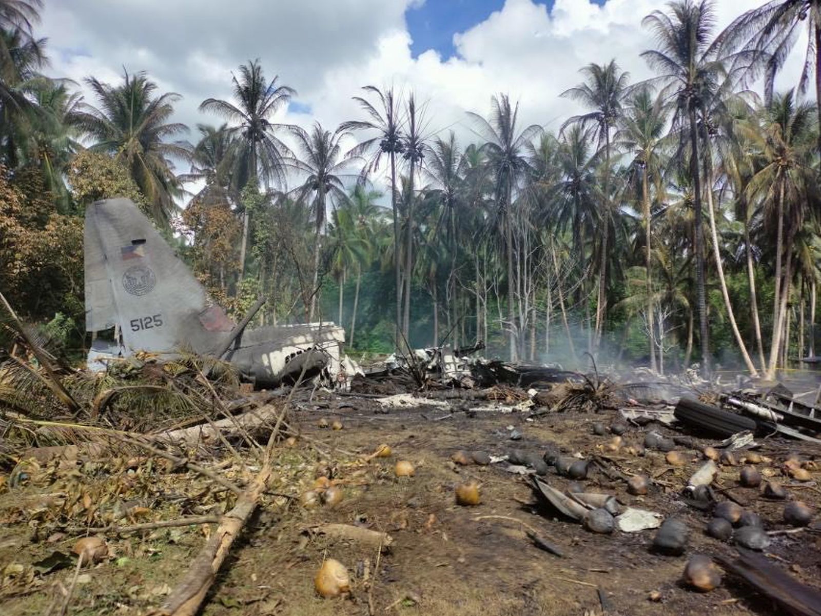 epa09321922 A handout photo made available by the Joint Task Force Jolo- Armed Forces of the Philippines (JTF-AFP) shows debris of a Philippine Air Force C-130 cargo plane at the vicinity of Jolo airport, Sulu island, Philippines, 04 July 2021. In a statement released by the office of Defense secretary Delfin Lorenzana, a C-130 aircraft of the Philippine Air Force crashed while landing at the Jolo airport on July 04,  with 92 soldiers on board including 3 pilots and 5 crew. As of the latest, 40 injured and wounded were rescued and 17 bodies recovered.  EPA/JTF HANDOUT  HANDOUT EDITORIAL USE ONLY/NO SALES