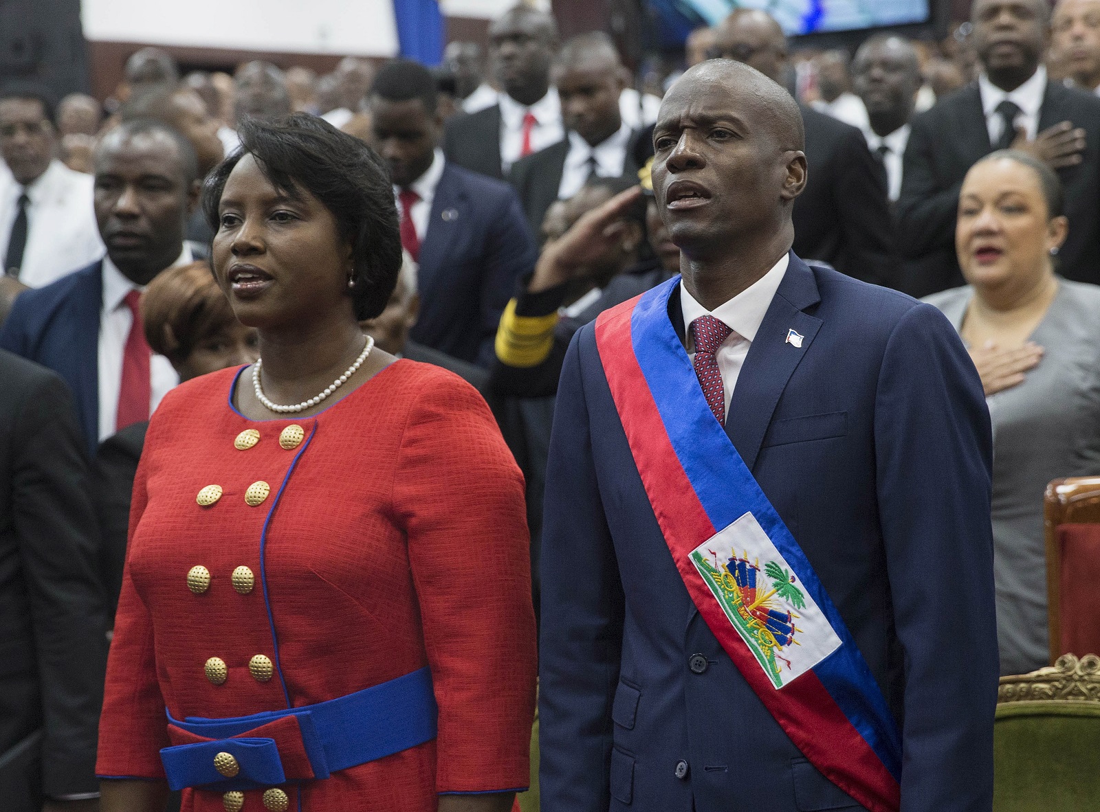 epa09328362 (FILE) - Haitian President Jovenel Moise (R) poses with his wife Martine Marie Etienne Joseph (L), during his investiture ceremony, at Legislative Palace in Poirt-Au-Prince, Haiti, 07 February 2017 (reissued 07 July 2021). According to a statement by Haiti's interim Prime Minister Claude Joseph cited by media, Haiti's President Jovenel Moise has allegedly been killed by a group of unidentified people who had entered his private residence, while his wife Martine was reportedly injured.  EPA/ORLANDO BARRIA *** Local Caption *** 55642594