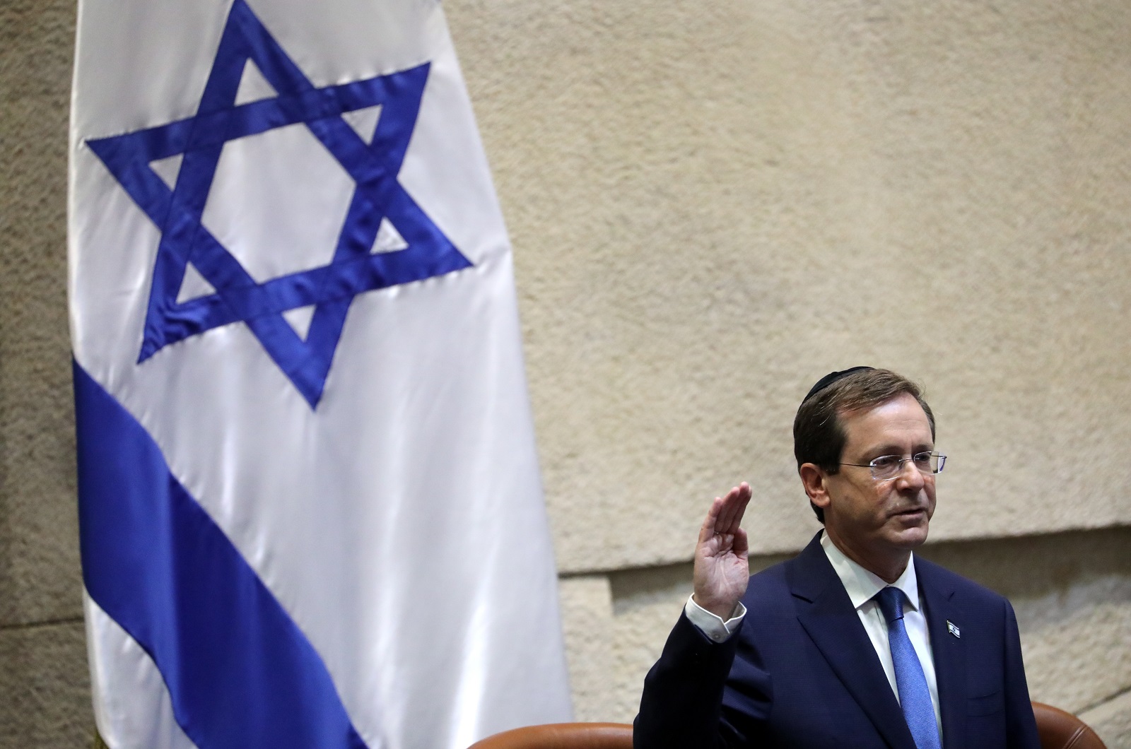 epaselect epa09328876 President elect Isaac Herzog swears in during his presidential swearing in ceremony at the Knesset, Israeli Parliament, in Jerusalem, 07 July 2021. Herzog is to hold office for a single seven-year term as Israel’s 11th president.  EPA/ABIR SULTAN
