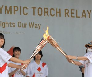 epa09333065 Torch relay runners make ceremonial lighting during a ceremony of the Tokyo 2020 Olympic Torch Relay at Machida in Tokyo, Japan, 09 July 2021. The Tokyo 2020 Olympic Torch Relay finally arrived in Tokyo on 09 July, two weeks before the opening of the Tokyo 2020 Olympic Games, which was delayed for one year due to the COVID-19 Coronavirus pandemic. Five-party meeting decided on 08 July 2021 Tokyo venues for the Summer Games will be held without spectator.  EPA/JIJI JAPAN OUT EDITORIAL USE ONLY/  NO ARCHIVES