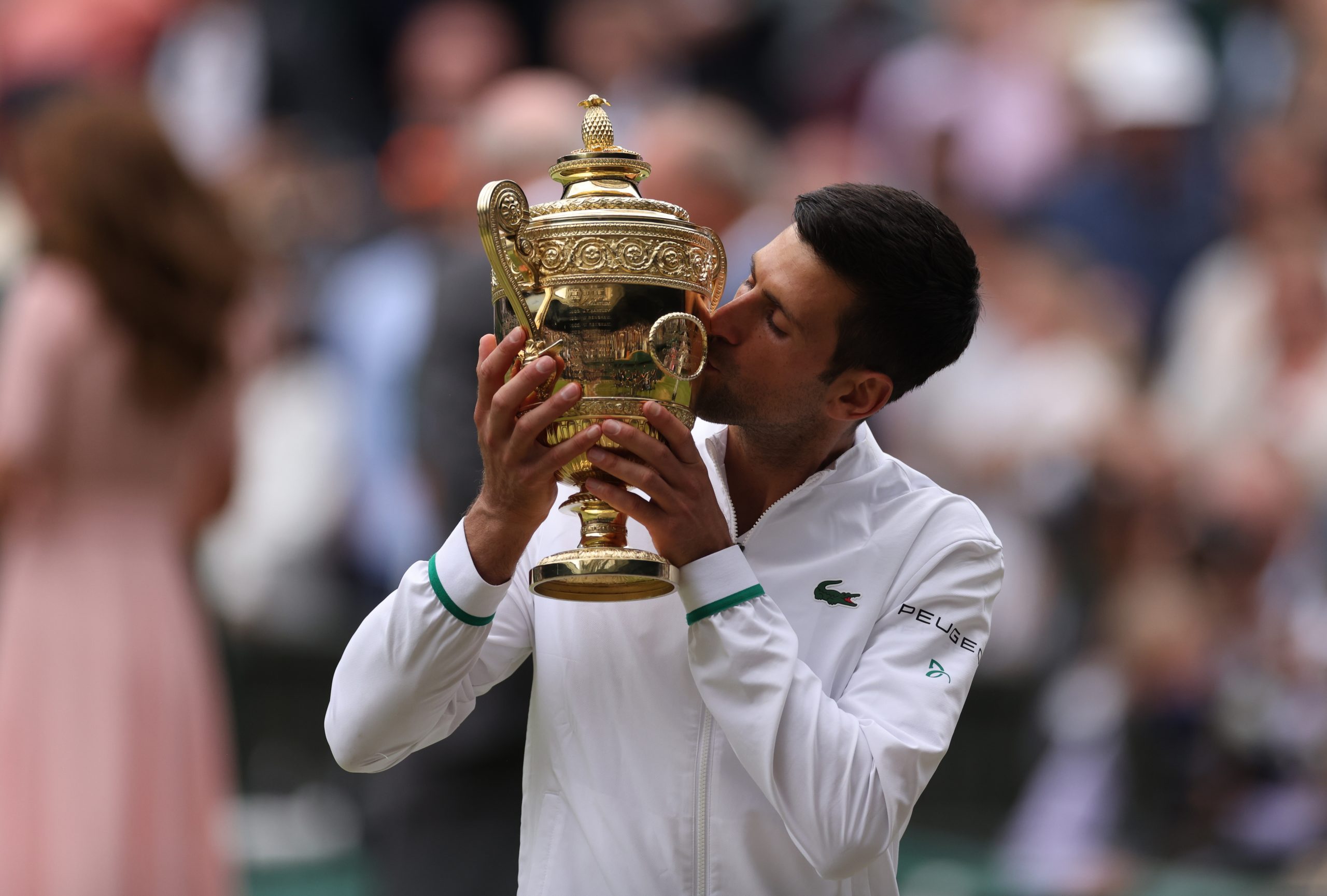 epa09337797 Novak Djokovic of Serbia poses for a photo with the trophy after winning the men's final against Matteo Berrettini of Italy at the Wimbledon Championships, Wimbledon, Britain 11 July 2021.  EPA/STEVE PASTON / POOL   EDITORIAL USE ONLY