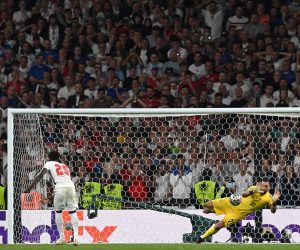 epa09338853 Goalkeeper Gianluigi Donnarumma of Italy saves the penalty of Bukayo Saka of England during the penalty shoot-out of the UEFA EURO 2020 final between Italy and England in London, Britain, 11 July 2021.  EPA/Carl Recine / POOL (RESTRICTIONS: For editorial news reporting purposes only. Images must appear as still images and must not emulate match action video footage. Photographs published in online publications shall have an interval of at least 20 seconds between the posting.)