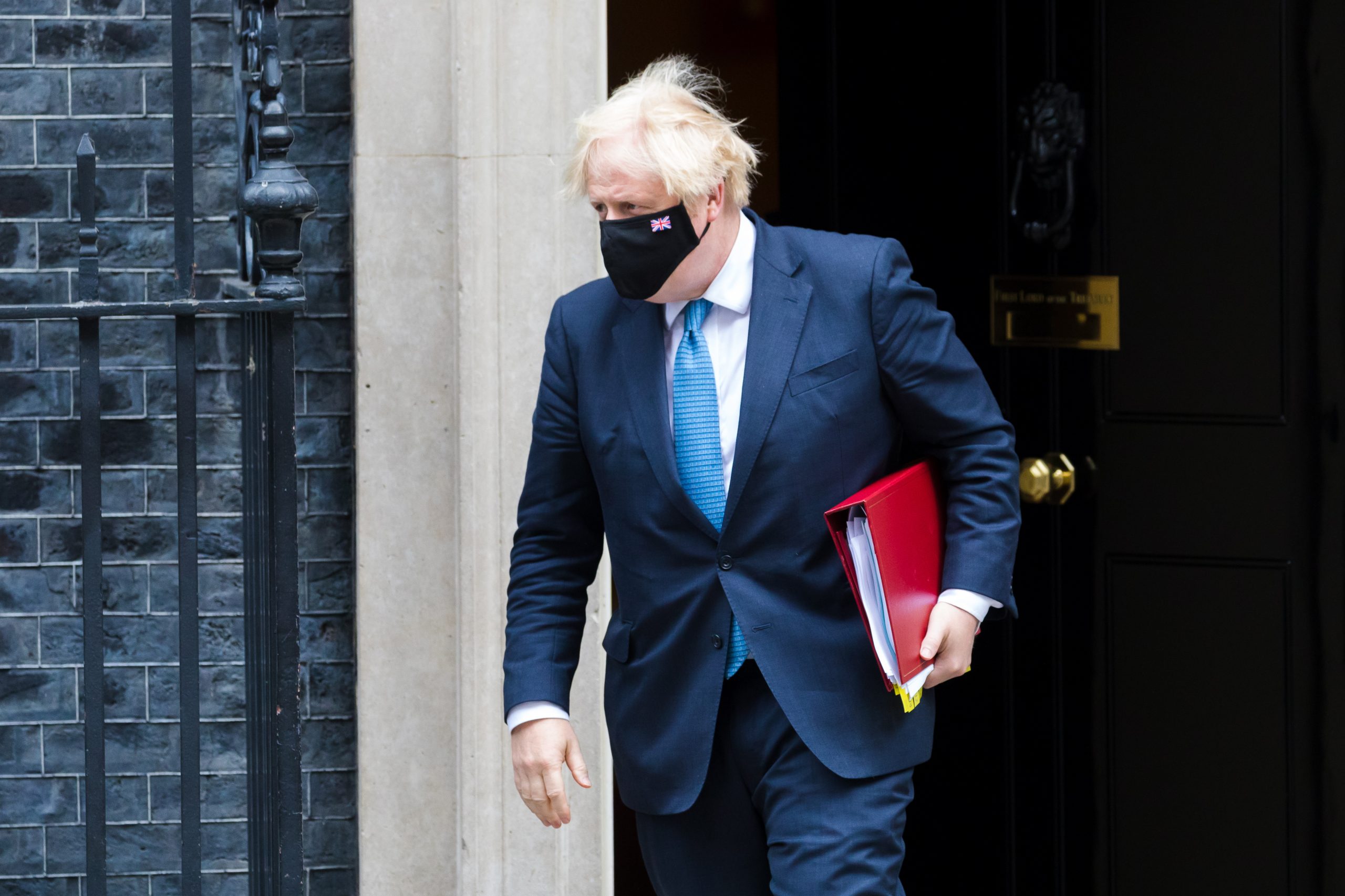 epa09343728 British Prime Minister Boris Johnson departs 10 Downing Street for Prime Minister Questions at parliament in London, Britain, 14 July 2021. Johnson faces the MPs' weekly question time in the House of Commons.  EPA/VICKIE FLORES