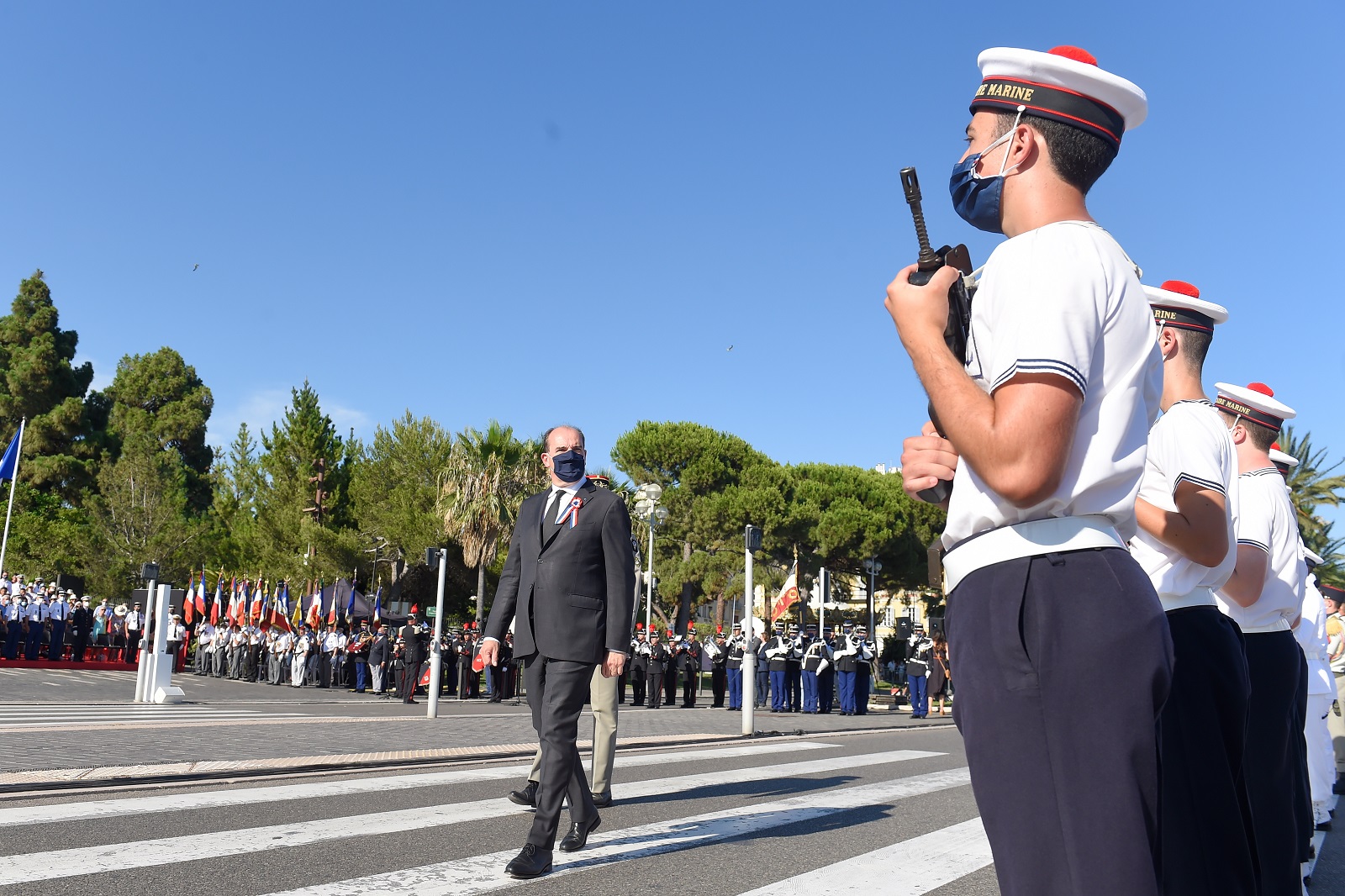 epa09344589 French Prime Minister Jean Castex (C) reviews troops during a military parade to mark the Bastille day in the coastal city of Nice, France, 14 July 2021. Castex visits Nice to attend a ceremony marking the 5th anniversary of a jihadist truck attack, which killed 86 people on Bastille Day on the Promenade des Anglais. A man drove a truck into a crowd, killing 86 people, in an attack claimed by the Islamic State group at a Bastille Day fireworks display.  EPA/NICOLAS TUCAT / POOL MAXPPP OUT