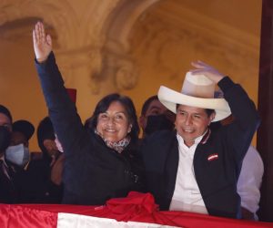 epa09353988 The leftist Pedro Castillo (R), accompanied by his formula to the Vice Presidency Dina Boluarte, greets supporters from a balcony after being proclaimed president-elect of the country, in Lima, Peru 19 July 2021. The official proclamation came this Monday, a month and a half after the elections in which he defeated the right-wing Keiko Fujimori, who delayed his appointment with more than a thousand challenges in which she denounced alleged 'fraud' without reliable evidence. After declaring the latest legal appeals presented by Fujimori unfounded, the National Elections Jury (JNE) endorsed the results of the 06 June vote, where Castillo obtained 50.12% of the valid votes, a narrow victory by just 44,263 votes over Fujimori.  EPA/Paolo Aguilar