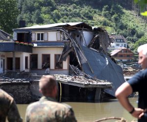 epa09356676 Bundeswehr soldiers inspect the damage in the village after the flooding of the Ahr River, in Rech in the district of Ahrweiler, Germany, 21 July 2021. Large parts of Western Germany were hit by heavy, continuous rain in the night to 15 July resulting in local flash floods that destroyed buildings and swept away cars.  EPA/FRIEDEMANN VOGEL