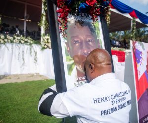 epa09360412 A man embraces a photograph with the image of President Jovenel Moise during his funeral ceremony in Cap-Haitien, Haiti, 23 July 2021. The wake in honor of the president of Haiti, Jovenel Moise, began this Friday in the city of Cap-Haitien, in the north of the country, hours before the burial of the president, who was murdered on July 7, takes place. The funeral service began two hours behind schedule and takes place in the gardens of the Habitation Village SOS, the Moise family's private residence on the outskirts of Cap-Haitien, which is guarded by a strong security apparatus.  EPA/Jean Marc Hervé Abélard