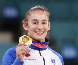 epa09367445 Gold medalist Nora Gjakova of Kosovo poses on the podium during the medal ceremony of the Women's Judo -57kg category at the Tokyo 2020 Olympic Games at the Nippon Budokan arena in Tokyo, Japan, 26 July 2021.  EPA/RUNGROJ YONGRIT