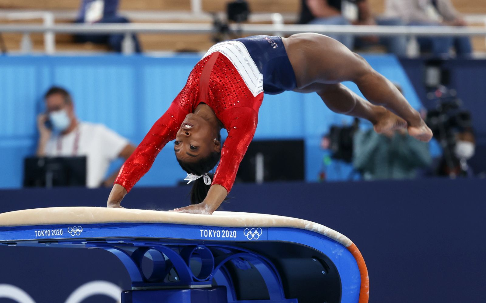 epa09370180 Simone Biles of the USA performs on the Vault during the Women's Team final during the Artistic Gymnastics events of the Tokyo 2020 Olympic Games at the Ariake Gymnastics Centre in Tokyo, Japan, 27 July 2021.  EPA/HOW HWEE YOUNG