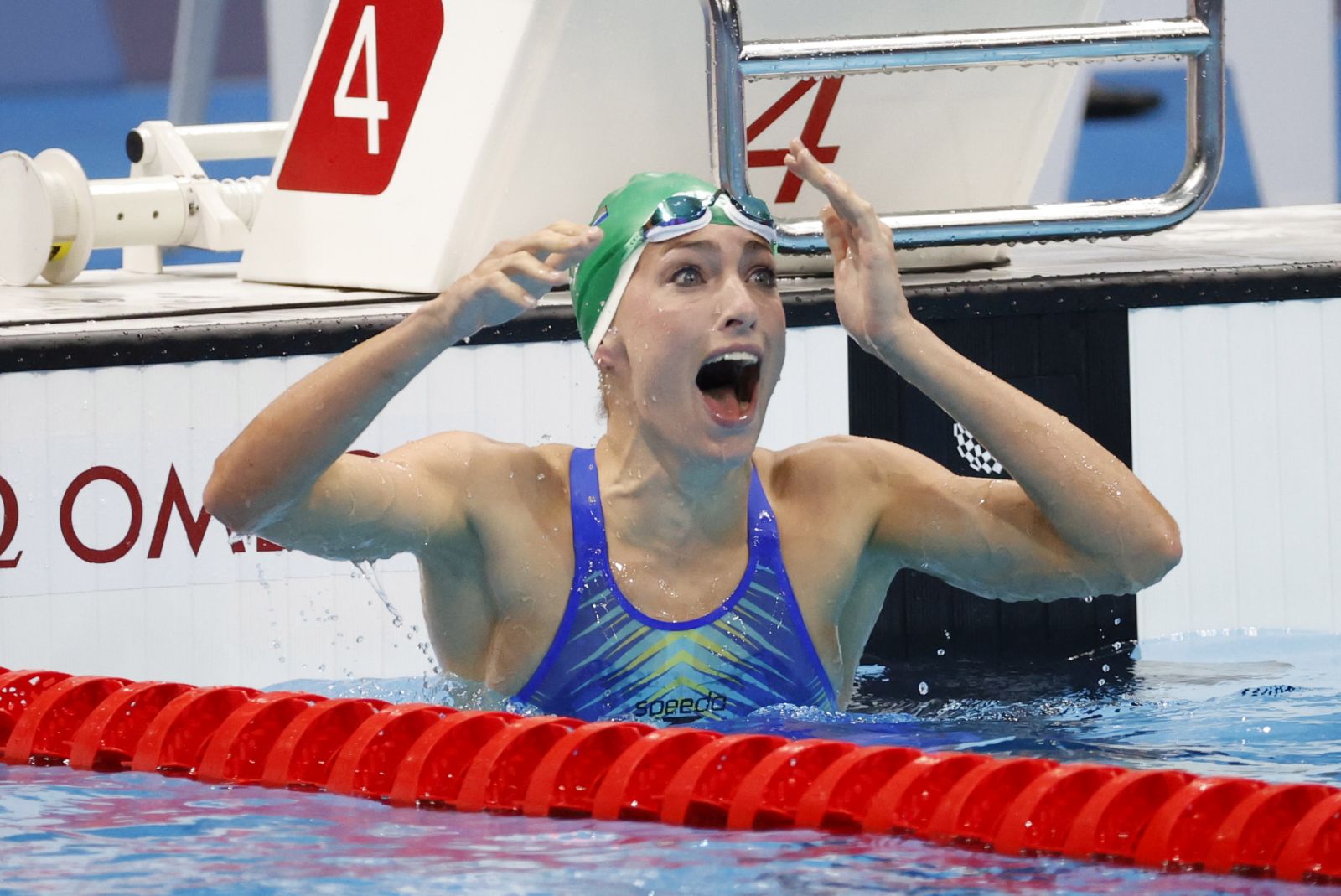 epa09378027 Tatjana Schoenmaker of South Africa reacts after seeing her World Record results in the Women's 200m Breastroke Final during the Swimming events of the Tokyo 2020 Olympic Games at the Tokyo Aquatics Centre in Tokyo, Japan, 30 July 2021.  EPA/HOW HWEE YOUNG