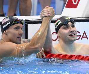 epa09381007 Gold medal winner Caeleb Dressel (L) of the USA and silver medal winner Kristof Milak (R) of Hungary celebrate after the final of men's 100m butterfly swimming event of the Tokyo 2020 Olympic Games at the Tokyo Aquatics Centre in Tokyo, Japan, 31 July 2021.  EPA/Tamas Kovacs HUNGARY OUT
