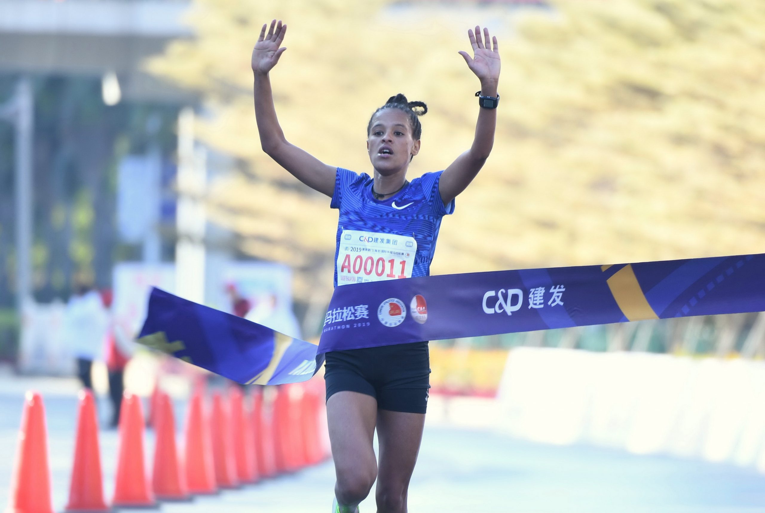 191208 -- XIAMEN, Dec. 8, 2019 -- Yalemzerf Yehualaw Densa of Ethiopia competes during the Xiamen Haicang International Half Marathon 2019 in Xiamen, southeast China s Fujian Province, Dec. 8, 2019.  SPCHINA-XIAMEN-XIAMENHAICANG INT L HALF MARATHON 2019 CN LinxShanchuan PUBLICATIONxNOTxINxCHN