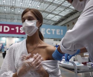 epa09346585 Anastasia Panfilova, soloist of the Russian 'Soprano Turetsky' Art Group receives a shot of Russia's Sputnik V vaccine against COVID-19 disease at a vaccination center in Gostinny Dvor, a huge exhibition place in Moscow, Russia, 15 July 2021. More than 500,000 Muscovites received the first component of the coronavirus vaccine in a week, Moscow being the epicentre of the new outbreak of the infections by the new Delta variant. Moscow authorities imposed a ban to serve people without QR-codes confirming vaccination against Covid-19 at public waterings, including people recovering from coronavirus Covid-19 disease within six months before the visit, or negative PCR test taken no earlier than 72 hours before the visit. More than 5,000 cases of COVID-19 were detected in Moscow, 32 per cent more than the day before.  EPA/MAXIM SHIPENKOV