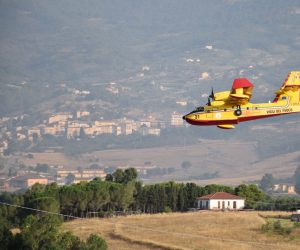 epa09379693 A handout photo made available by Vigili del Fuoco (VVF), the Italian National Fire Brigade, shows a canadair water bomber aircraft of the Vigili del Fuoco conducting extinguishing operations of a forest fire affecting an area between Piana degli Albanesi and Altofonte, near Palermo, Sicily Island, southern Italy, 30 July 2021. Since 29 July evening emergency teams worked to counter the numerous flame fronts, fueled by strong winds and high temperatures, that have devastated the Palermo area.  EPA/VIGILI DEL FUOCO HANDOUT -- BEST QUALITY AVAILABLE -- HANDOUT EDITORIAL USE ONLY/NO SALES