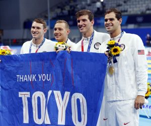 epa09383784 USA's Ryan Murphy, Michael Andrew, Caeleb Dressel and Zach Apple celebrate with their gold medals after the Men's 4 x 100m Medley Relay Final during the Swimming events of the Tokyo 2020 Olympic Games at the Tokyo Aquatics Centre in Tokyo, Japan, 01 August 2021.  EPA/HOW HWEE YOUNG