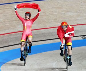 epa09387409 Zhong Tianshi (L) and Bao Shanju of China celebrate after China won gold in the Women's Team Sprint during the Track Cycling events of the Tokyo 2020 Olympic Games at the Izu Velodrome in Ono, Shizuoka, Japan, 02 August 2021.  EPA/CHRISTOPHER JUE