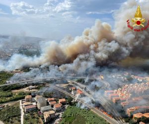 epa09387602 A handout photo made available by Vigili del Fuoco (VVF), the Italian National Fire Brigade, shows an aerial view of a fire in the Pineta Dannunziana reserve in Pescara, Abruzzo region, central Italy, 01 August 2021 (issued 02 August 2021). Five teams of firefighters conducted extinguishing operations along with two helicopters and a Canadair aircraft, VVF said. More than 100 people from their homes and at two beaches in Pescara were evacuated.  EPA/VIGILI DEL FUOCO HANDOUT -- BEST QUALITY AVAILABLE -- HANDOUT EDITORIAL USE ONLY/NO SALES