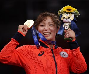 epa09395178 Gold medalist Yukako Kawai of Japan poses with their medal in the Women's Freestyle 62kg category of the Wrestling events of the Tokyo 2020 Olympic Games at the Makuhari Messe convention centre in Chiba, Japan, 04 August 2021.  EPA/RITCHIE B. TONGO