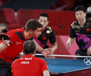 epa09400193 Timo Boll (R) und Patrick Franziska (R) of Germany in action during the Table Tennis men's team cold medal match against Ma Long and Xu Xin of China during the Tokyo 2020 Olympic Games at the Tokyo Metropolitan Gymnasium arena in Tokyo, Japan, 06 August 2021.  EPA/MAST IRHAM