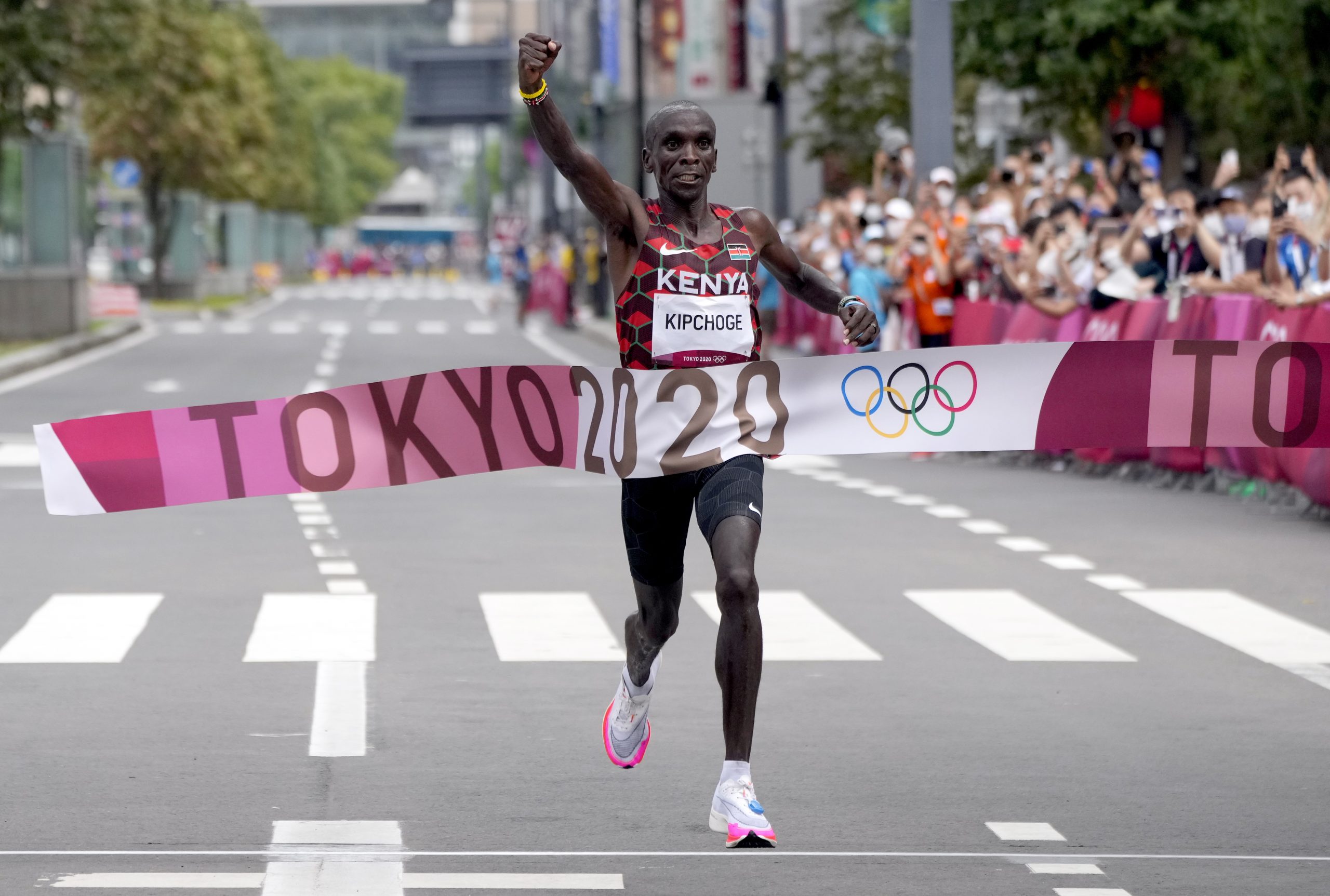 epa09404975 Eliud Kipchoge of Kenya reacts while crossing the finish line first to win the Gold medal in the Men's Marathon during the Athletics events of the Tokyo 2020 Olympic Games at the Odori Park in Sapporo, Japan, 08 August 2021.  EPA/KIMIMASA MAYAMA