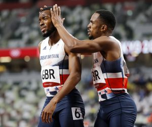 epa09401630 Nethaneel Mitchell-Blake (L) of Great Britain reacts after placing second in the Men's 4x100m Relay final of the Athletics events of the Tokyo 2020 Olympic Games at the Olympic Stadium in Tokyo, Japan, 06 August 2021.  EPA/VALDRIN XHEMAJ