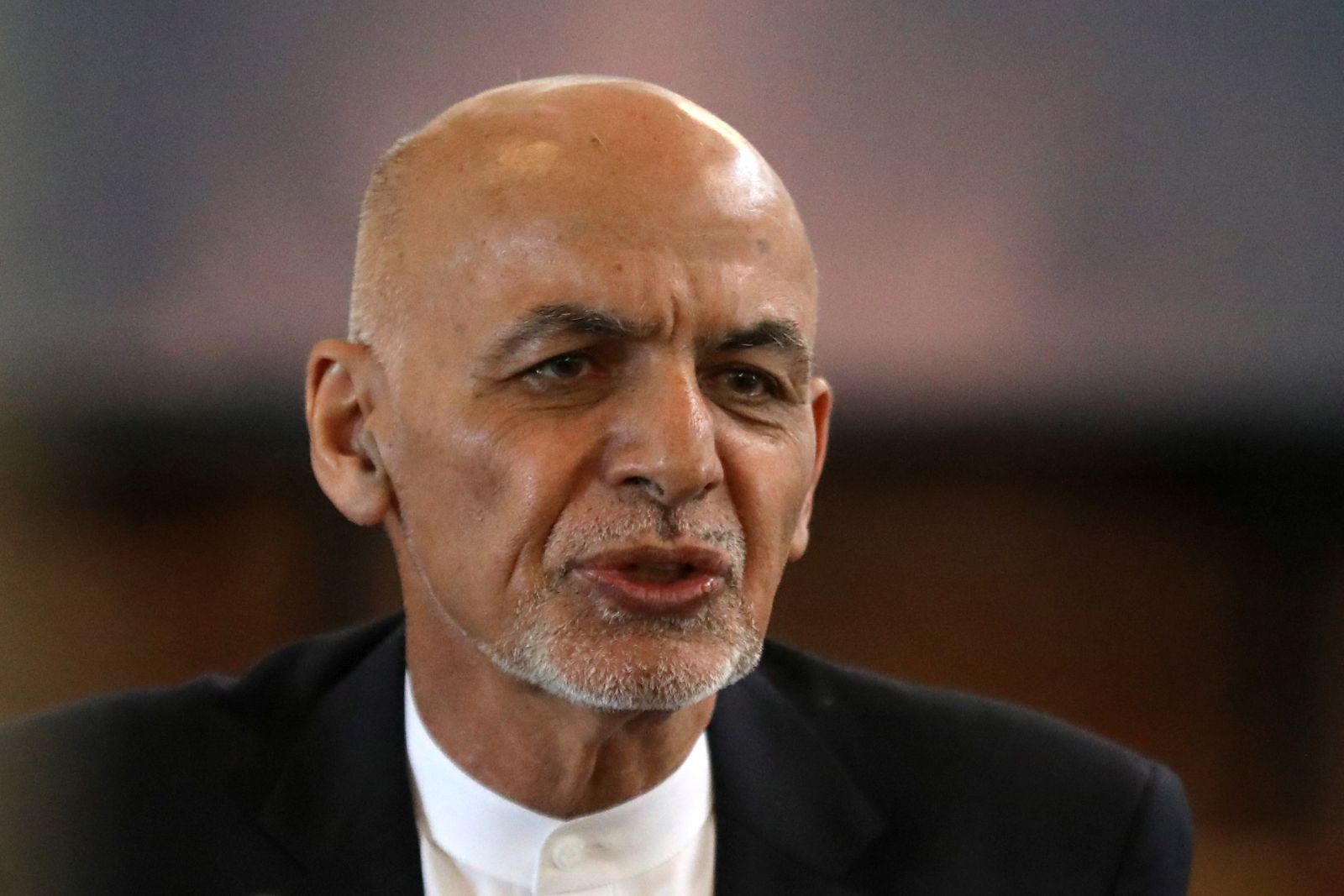 epa09415350 (FILE) - Afghanistan President Ashraf Ghani speaks during celebrations to mark the Persian New Year Nowruz at the presidential palace in Kabul, Afghanistan, 21 March 2021 (reissued 15 August 2021). According to a senior Afghan Interior Ministry official, Ashraf Ghani has left the country, as Taliban militants have reached the outskirts of Kabul. The insurgents said they will not enter the capital by force and are negotiating a peaceful transition of power.  EPA/HEDAYATULLAH AMID