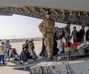 epa09418813 A handout picture provided by the British Ministry of Defence (MOD) shows British citizens and dual nationals residing boarding a military plane at the airport in Kabul, Afghanistan, 16 August 2021 (issued 18 AAugust 2021) As part of Operation PITTING, the UK Armed Forces are enabling the evacuation of British personnel from Afghanistan. On 16 August the first flight of evacuated personnel arrived at RAF Brize Norton in the UK. The flight constituted of British Embassy staff and British Nationals.  EPA/LPhot Ben Shread/BRITISH MINISTRY OF DEFENCE/HANDOUT MANDATORY CREDIT: MOD/CROWN COPYRIGHT
ATTTENTION EDITORS: 
** Some blurring of faces has been applied to protect identities **
** Some blurring of faces has been applied by source to protect identities ** HANDOUT EDITORIAL USE ONLY/NO SALES