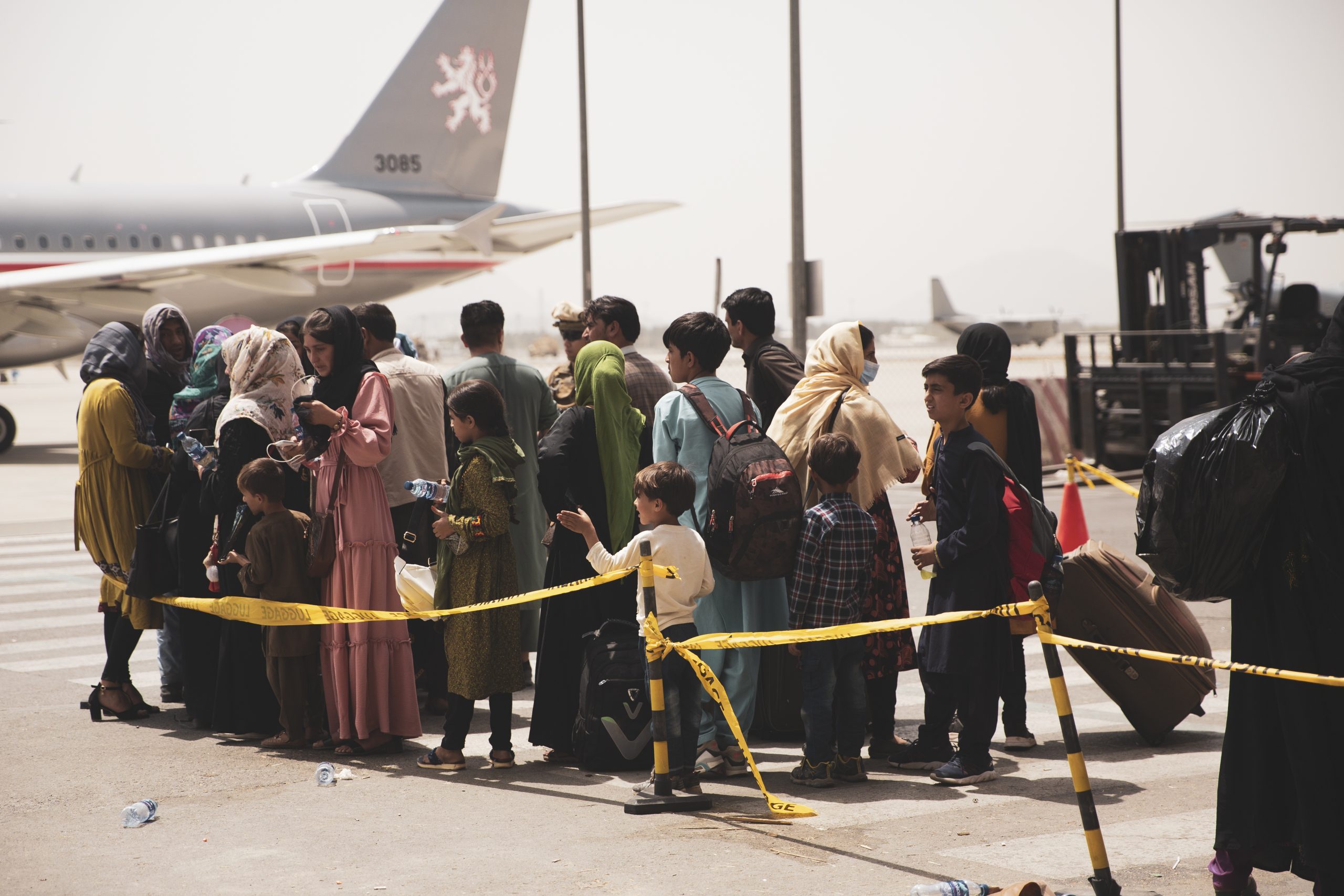 epa09421074 A handout photo made available by US Central Command Public Affairs shows civilians preparing to board a plane during an evacuation at Hamid Karzai International Airport, Kabul, Afghanistan, 18 August 2021 (issued 19 August 2021). US Marines are assisting the Department of State with an orderly drawdown of designated personnel in Afghanistan. (U.S. Marine Corps photo by Staff Sgt. Victor Mancilla)  EPA/Staff Sgt. Victor Mancilla/ US Central Command Public Affairs HO Released By:

LT Robert Mook

Public Affairs Officer

Joint Task Force-Crisis Response

robert.e.mook2.mil@mail.mil HANDOUT EDITORIAL USE ONLY/NO SALES