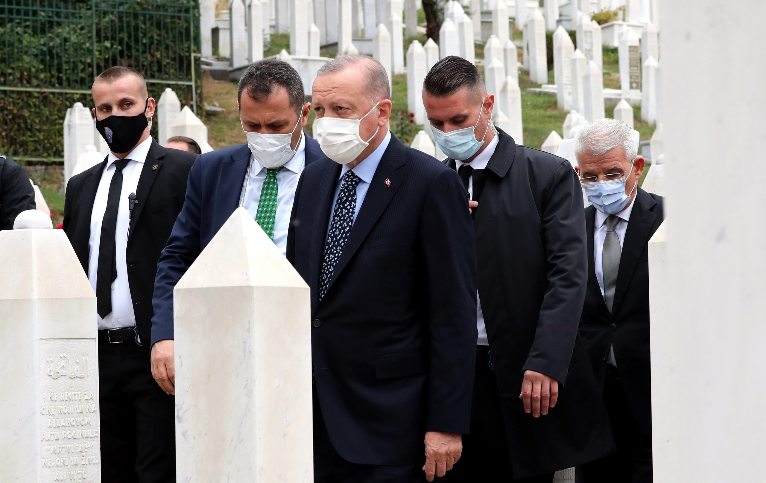 epa09432126 Turkish President Recep Tayyip Erdogan (C) and Member of the Bosnian Presidency Sefik Dzaferovic (R) at the Military Cemetery  Cemetery Kovaci, in Sarajevo, Bosnia and Herzegovina, 27 August 2021. Erdogan is currently on a one-day visit to Sarajevo.  EPA/FEHIM DEMIR