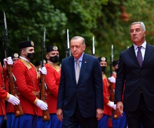 epa09433512 Turkish President Recep Tayyip Erdogan (C) and his Montenegrian counterpart Milo Djukanovic (R) inspect the honour guard during a welcoming ceremony at the Presidential residence in Cetinje, Montenegro, 28 August 2021. President Erdogan arrived in Montenegro for a one-day official visit.  EPA/BORIS PEJOVIC