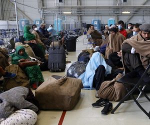 epa09436872 Evacuees from Afghanistan wait in a terminal for their flight to USA at the US Air Base in Ramstein, Germany, 30 August 2021. Ramstein Air Base is serving as major hub in the operation to evacuate people from Afghanistan, as the site is the world's largest US air force base outside the United States of America.  As part of Operation Allies Refuge, evacuees will receive support such as temporary lodging, food and water and access to medical care as well as religious care at Ramstein Air Base while preparing for onward movements to their final destinations. This operation is facilitating the quick, safe evacuation of US citizens, Special Immigrant Visa applicants, and other at-risk Afghans from Afghanistan.  EPA/RONALD WITTEK